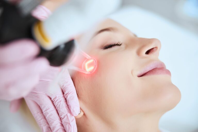 stock-photo-close-up-portrait-of-a-young-woman-patient-receiving-a-laser-treatment-in-a-spa-salon-1870336165
